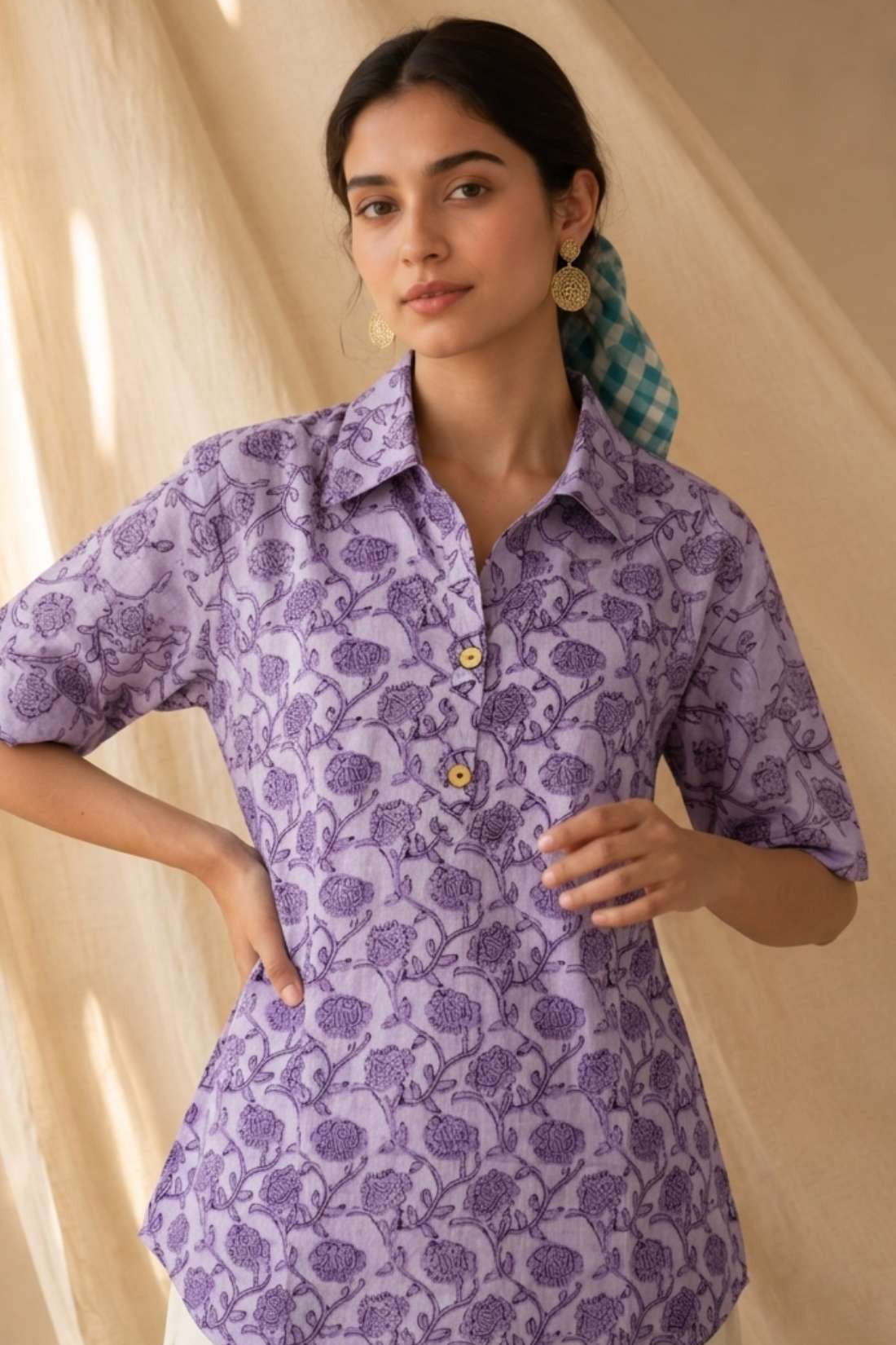 Front close-up of a women's lavender floral hand block print cotton shirt with wooden buttons and classic collar.