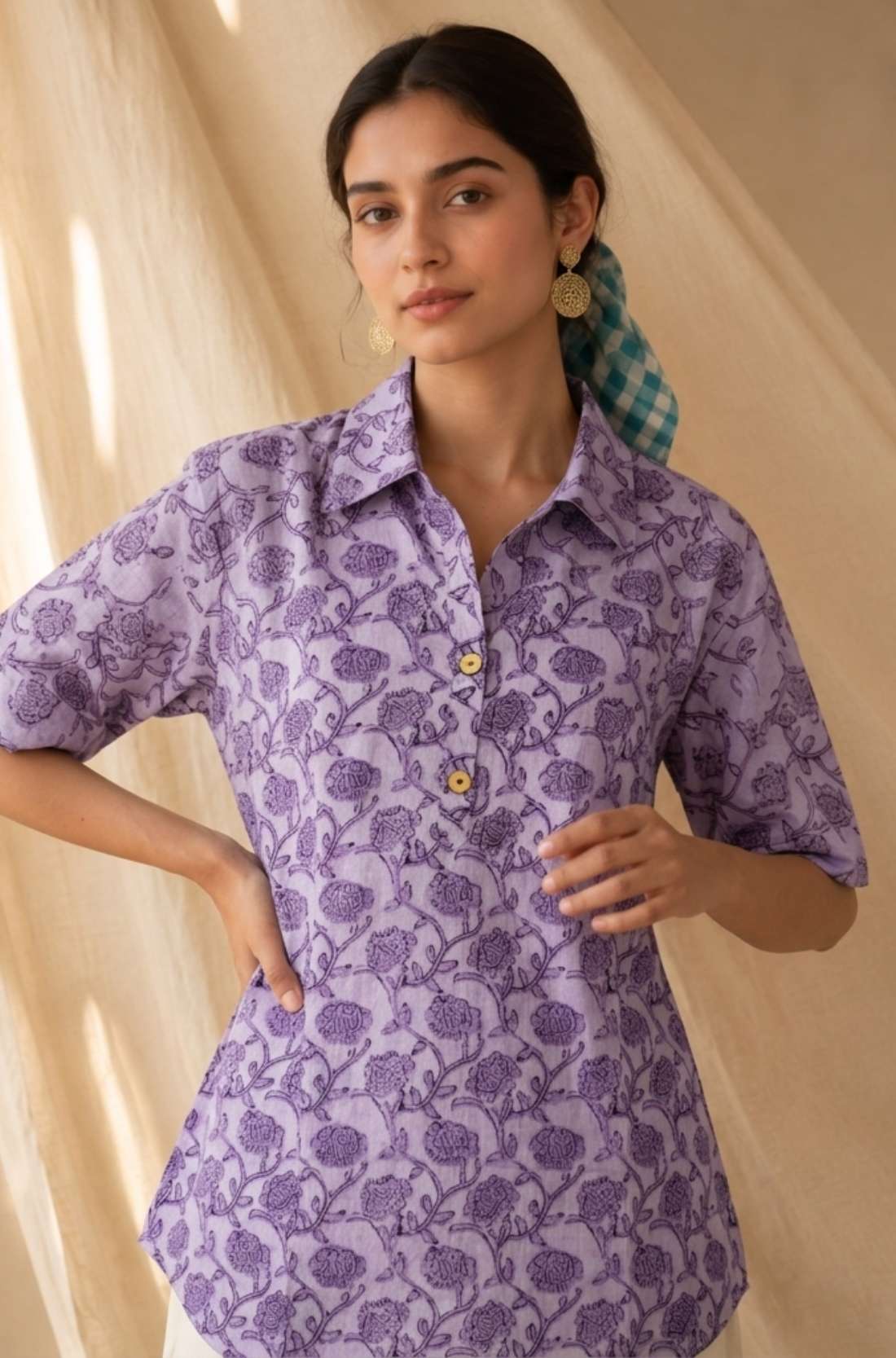 Front close-up of a women's lavender floral hand block print cotton shirt with wooden buttons and classic collar.