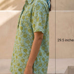Side view of a women's mint green hand block print cotton shirt with short sleeves, collared neckline, and relaxed fit.