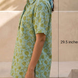 Side view of a women's mint green hand block print cotton shirt with short sleeves, collared neckline, and relaxed fit.