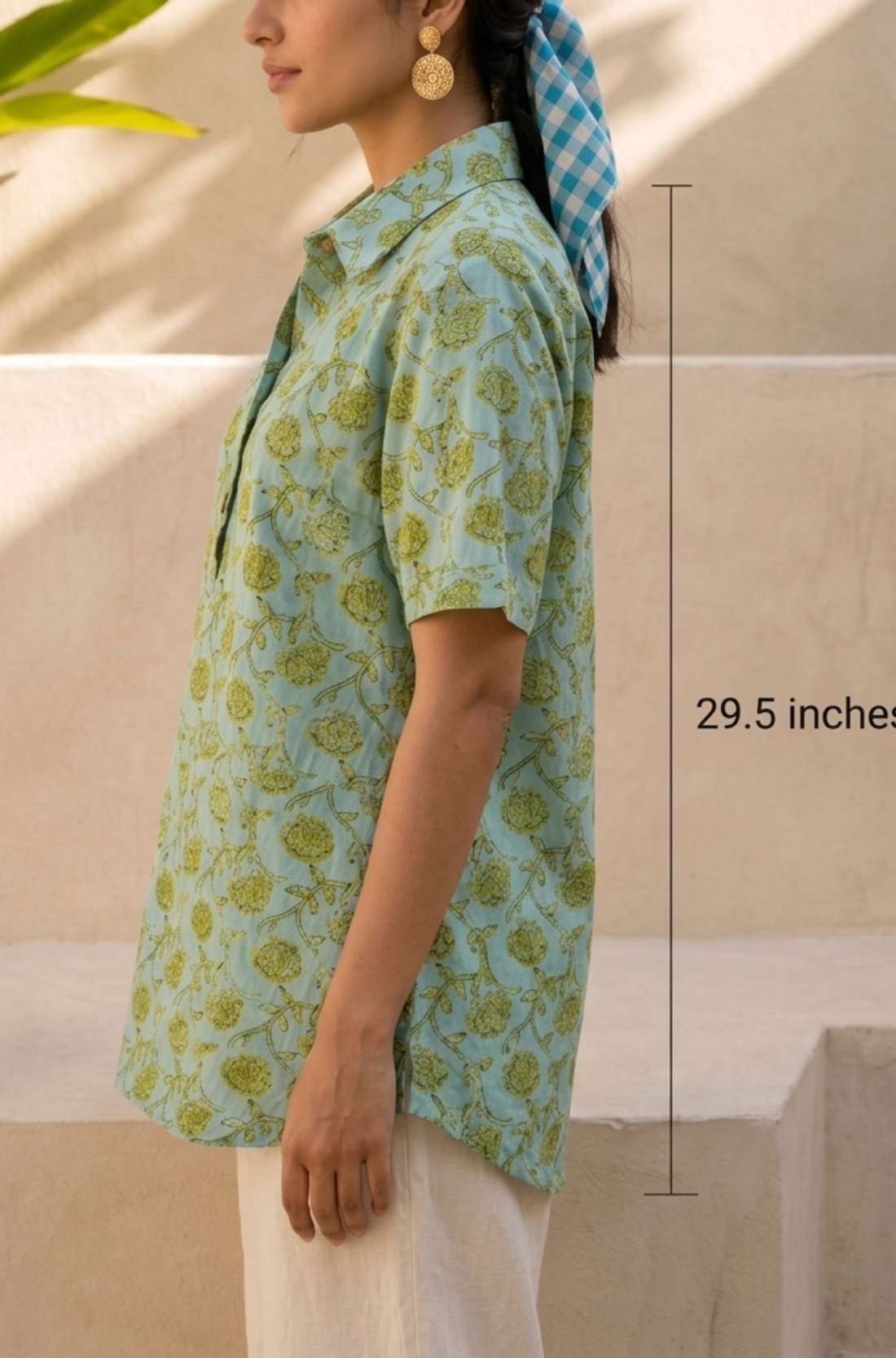 Side view of a women's mint green hand block print cotton shirt with short sleeves, collared neckline, and relaxed fit.