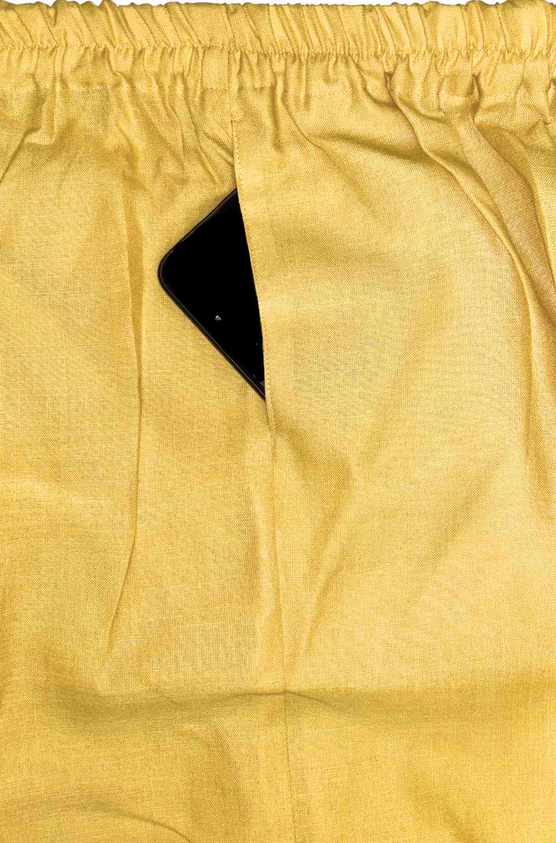 yellow kurta set bottom showing pocket and elastic waistband 