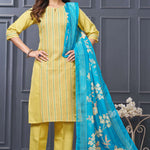 Profile view of a model in a yellow cotton ethnic suit set displaying the straight-cut pants silhouette and the beautiful pattern of the draped matching dupatta