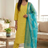Front full length view of a model in a yellow pure cotton kurta set featuring thread embroidery lines, paired with straight pants and a matching printed dupatta